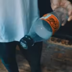 Slo Mo Coin in Bottle by Lloyd Barnes